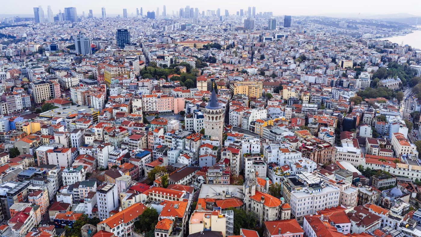 Aerial view of the Galata Tower with Istanbul's business districts in the background
